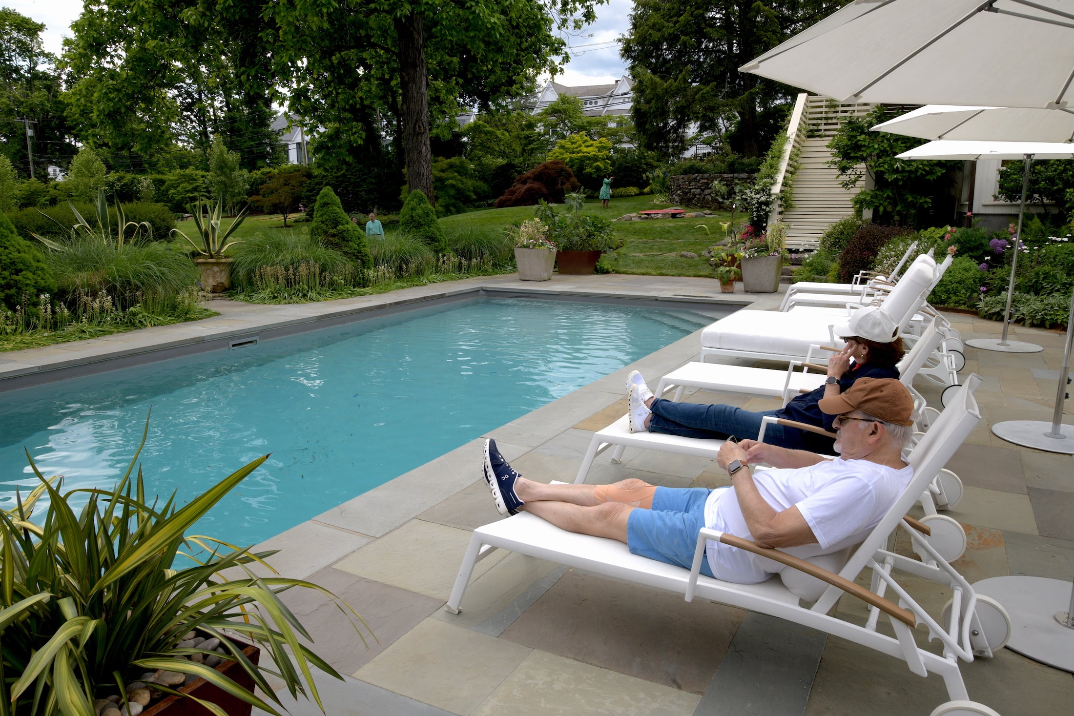Milt Wolfson, Weston, Leslie Gallant Westport reclining poolside at the main pool area