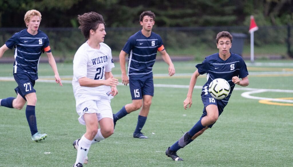 Staples’ swarming defense includes (from left) Bruno Guiduli, Jackson Hochhauser and Mattthew Genser. - Photo Barry Guiduli
