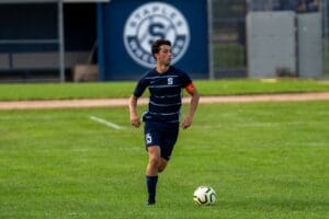Tri-captain and center back Jackson Hochhauser surveys the field. Photo Barry Guiduli.
