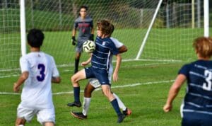 Will Adams slips inside a Danbury defender - Photo Mark Sikorski