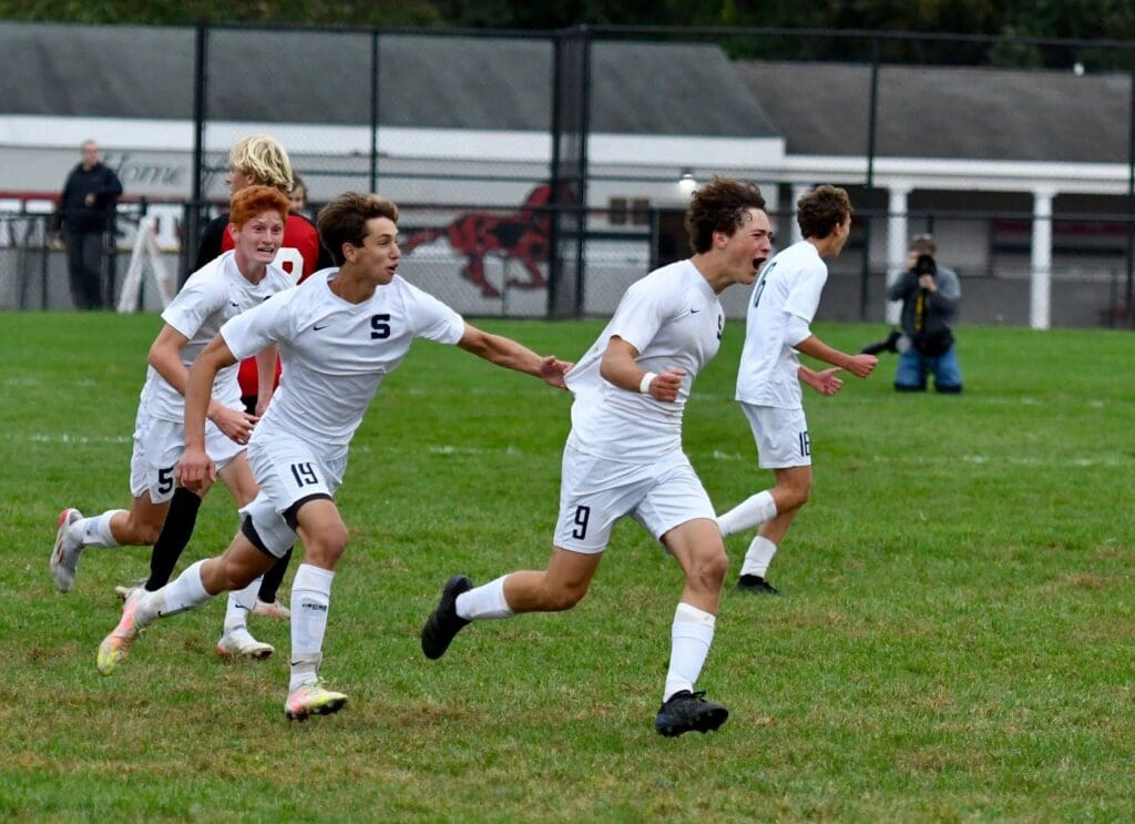 Reese Watkins celebrates game-winner vs Warde - Photo - Mark Sikorski