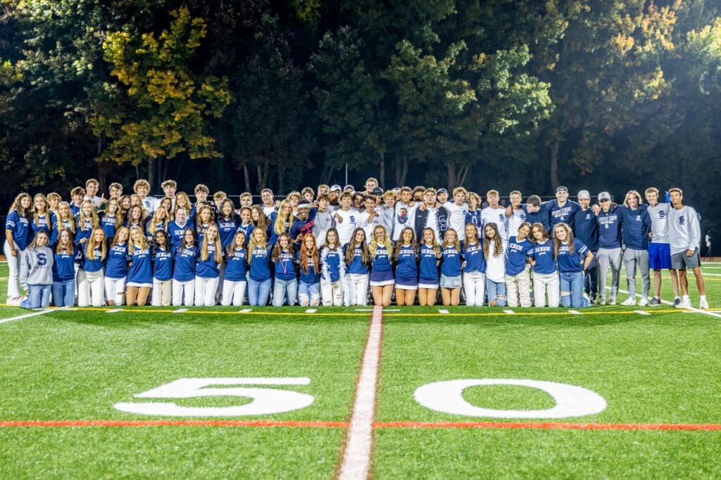 Staples team captains gather at the 50-yard line -- Photo Chris Greer