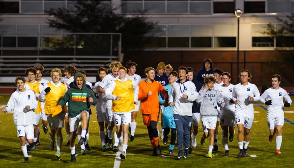Team celebrates the final regular season victory - Photo Barry Guiduli