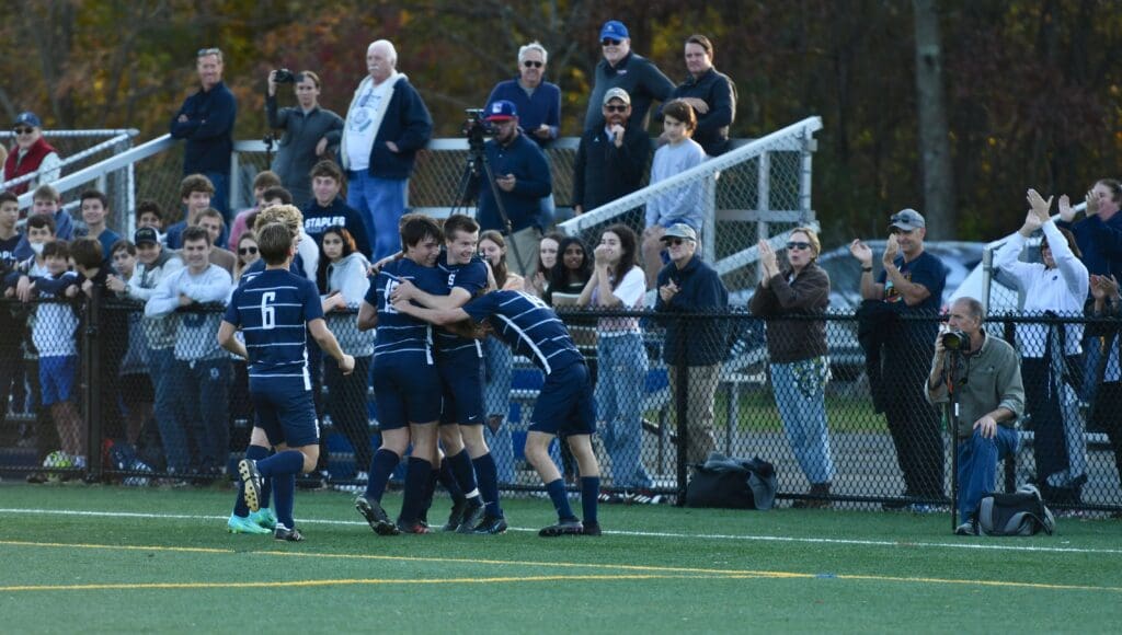 … and then celebrates with teammates - Photos Mark Sikorski