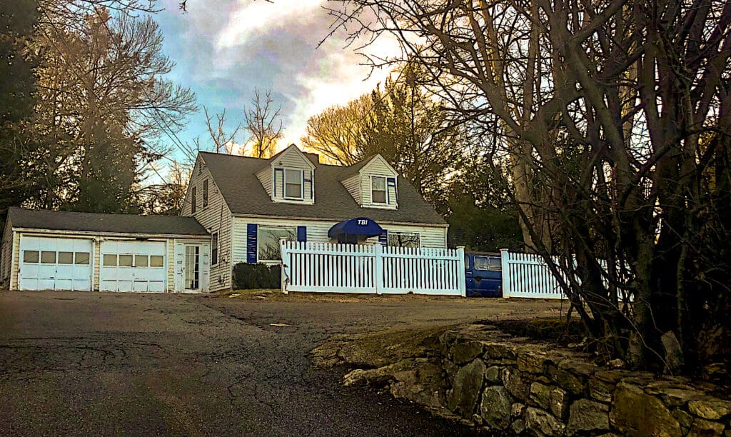 This house behind 50 Post Road West would be replaced with a four-apartment structure. / Photo by Thane Grauel.