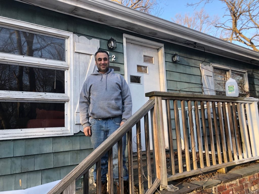 Mark Lazar in front of 24 Hiawatha Lane Extension, in February. / Photo by Thane Grauel.