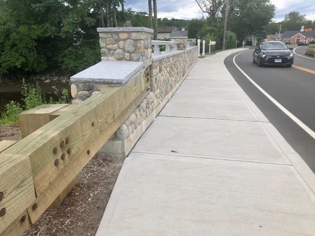 A new bridge on King's Highway North in Westport has riverstones and wooden guardrails. / Photo by Thane Grauel.