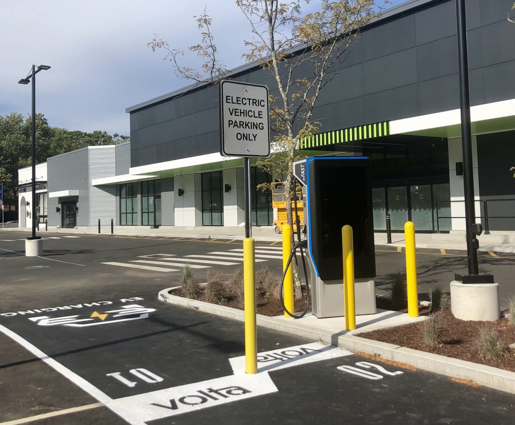 Two Volta electric vehicle charging stations have been installed outside the Amazon Fresh store under construction at the Post Plaza. / Photo by Thane Grauel.