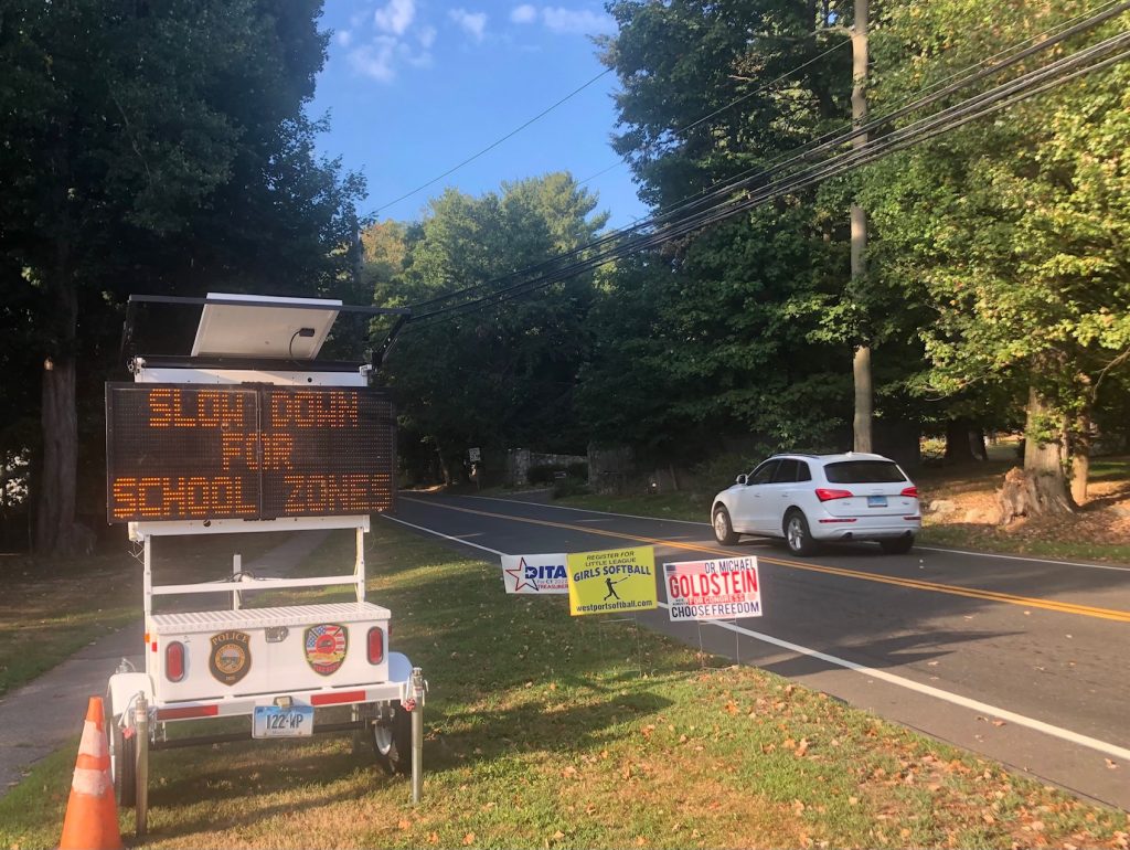 Variable message signs around town, including this one on Easton Road, urge drivers to slow down because school is starting. / Photo by Thane Grauel.