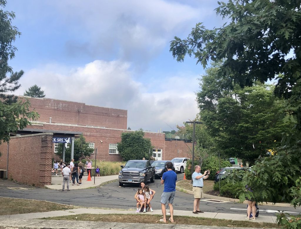Family photos outside Saugatuck Elementary School on Tuesday morning. / Photo by Thane Grauel.