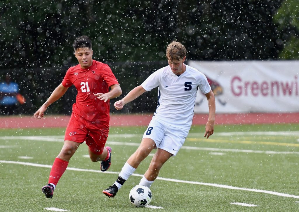 Cole Lieberman gets position at Greenwich, in a brief but heavy downpour - Photo Mark Sikorski