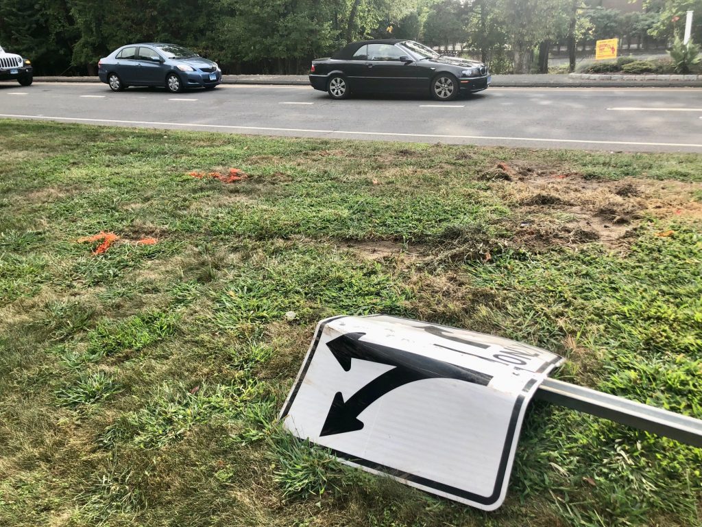 The car that rolled over at the north end of the Sherwood Island Connector on Thursday night appears to have veered off Post Road East. It came to rest on a grassy area between the road and the Walgreen's parking lot. / Photo by Thane Grauel.