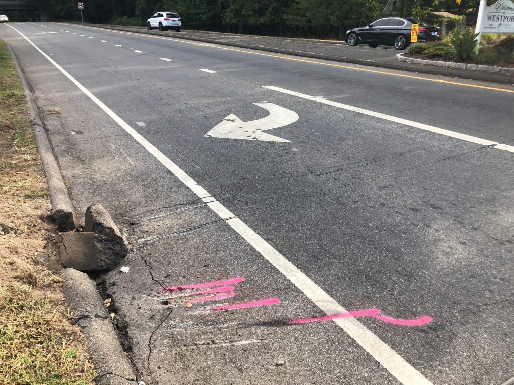The car that rolled over at the north end of the Sherwood Island Connector on Thursday night appears to have veered off Post Road East and struck a median with an ornamental rock. / Photo by Thane Grauel.