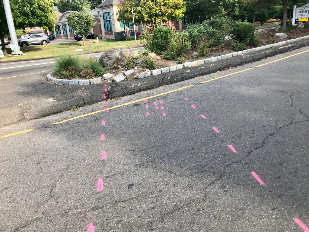 The car that rolled over at the north end of the Sherwood Island Connector on Thursday night appears to have veered off Post Road East and struck a median with an ornamental rock. / Photo by Thane Grauel.