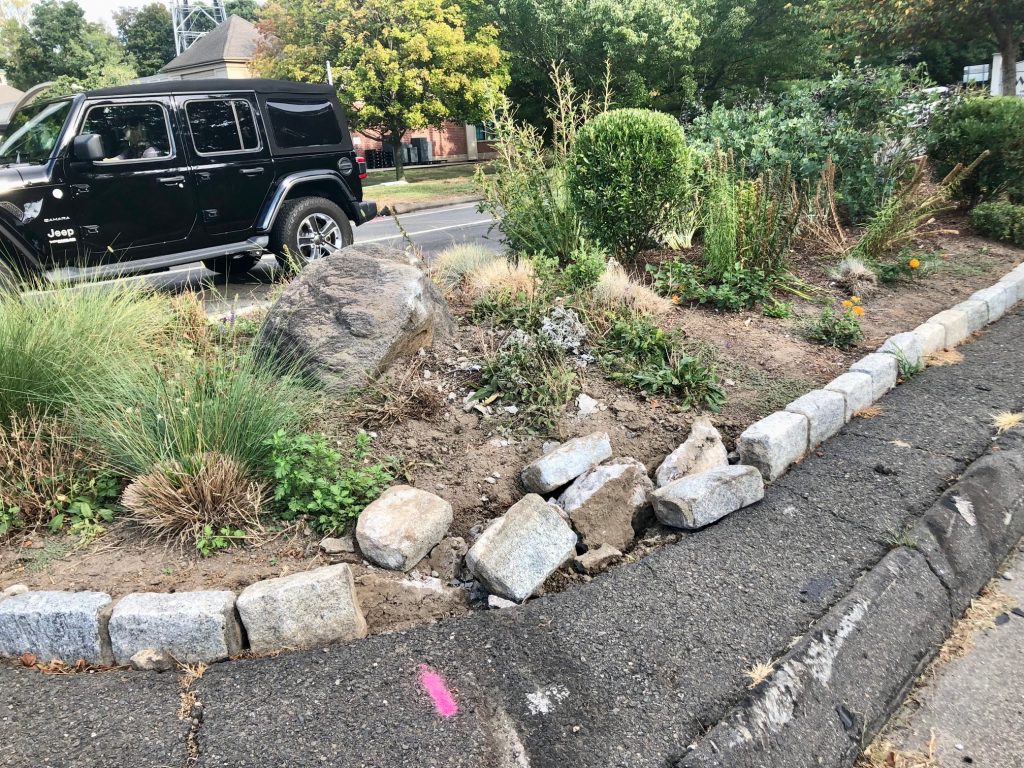 The car that rolled over at the north end of the Sherwood Island Connector on Thursday night appears to have veered off Post Road East and struck a median with an ornamental rock. / Photo by Thane Grauel.