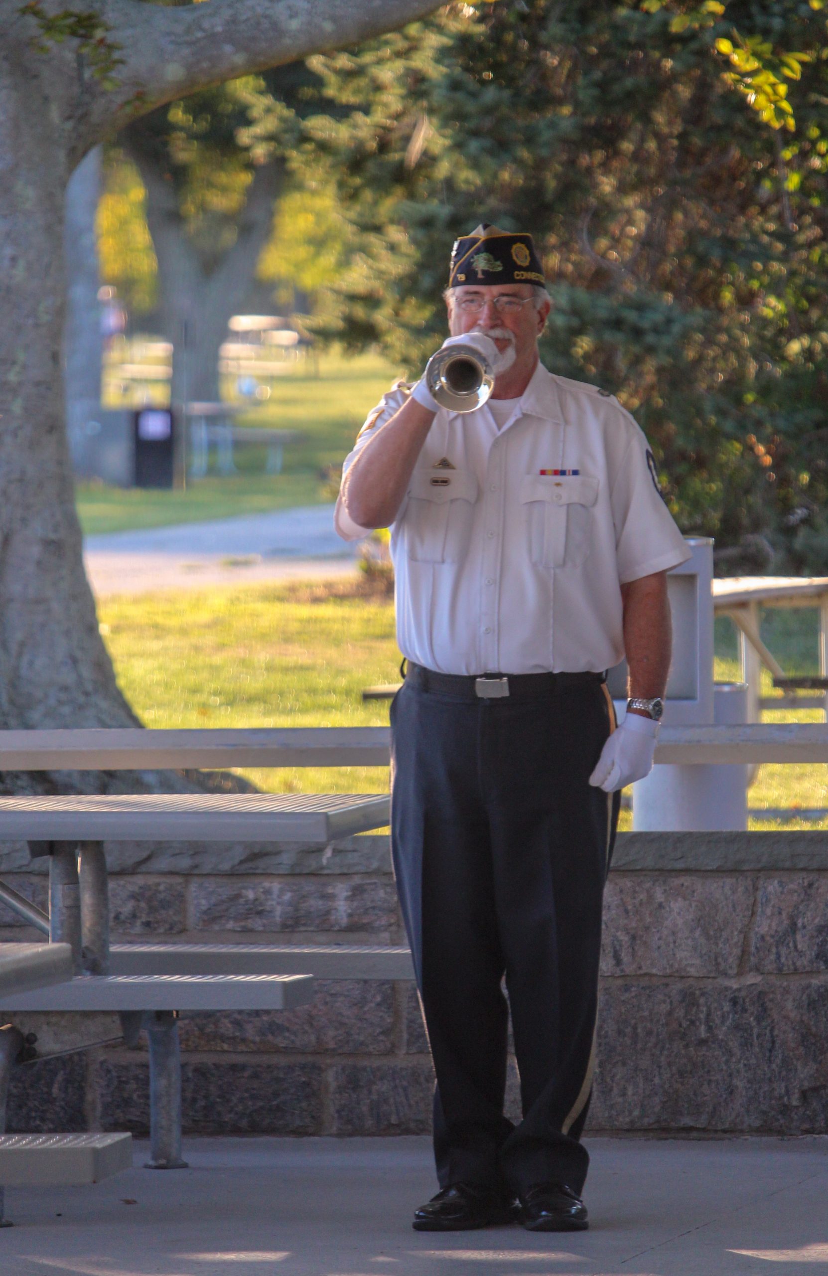 A bugler blows taps at the end of the Sept. 11 ceremony at Sherwood Island State Park. / Photo by Thane Grauel.