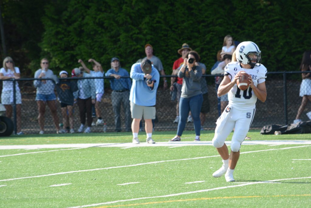 Quarterback Caleb Smith looks to pass during a road game at St. Joseph this fall. Smith and the Wreckers won at Newington on Friday night - Photo Andy Hutchison