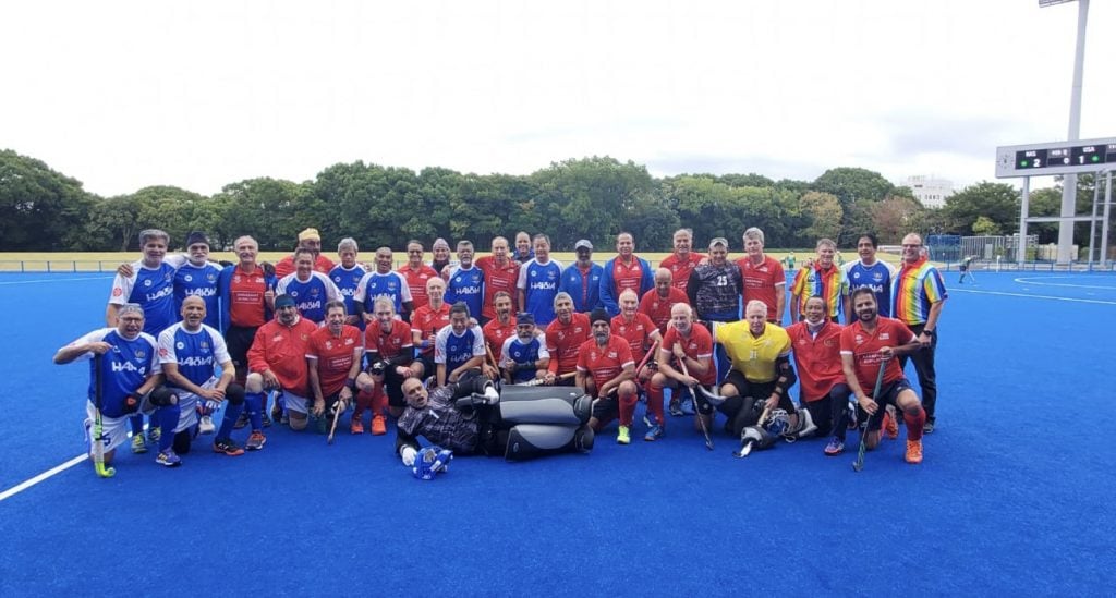 Ian Tapsall, fourth from right in front, is pictured with his US team during its visit to Tokyo for the World Masters Hockey World Cup. Tapsall has played field hockey for more than 50 years.