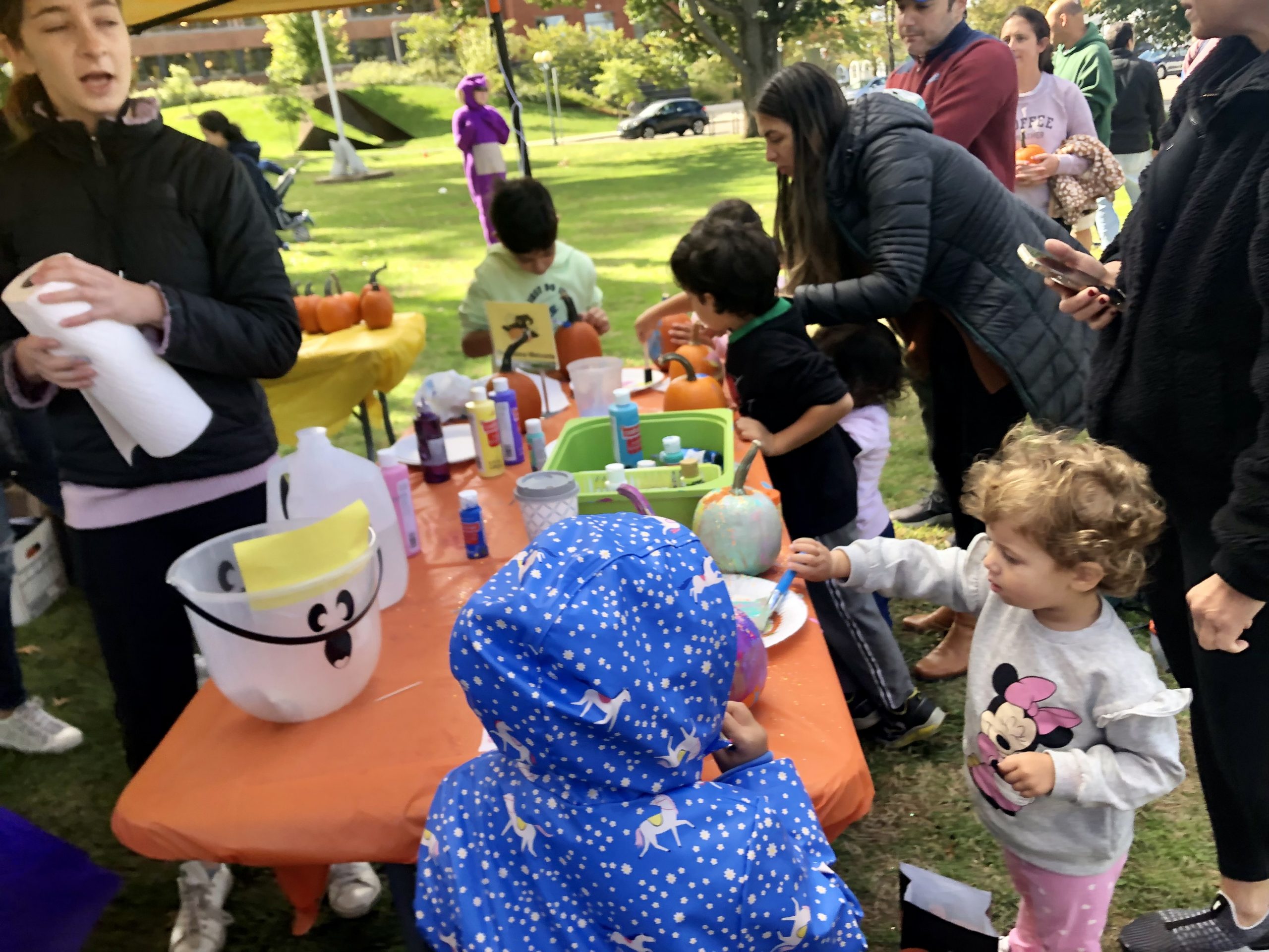 Kids decorate pumpkins at Saturday's Oaktober event on Jesup Green. / Photo by Thane Grauel.