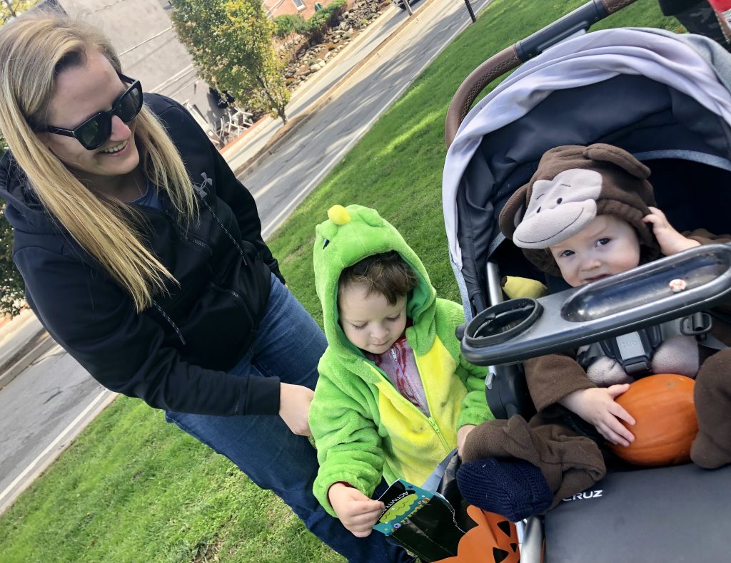 Brothers George and, in stroller, Henry Horne, with their aunt, Samantha Farnall at Saturday's Oaktober event on the Jesup Green. The boys got pumpkins and other goodies. / Photo by Thane Grauel