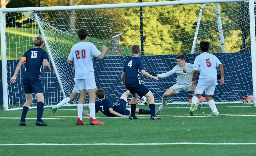 Sam Rossoni (#7) scores the first goal of his varsity career – Photo Mark Sikorski