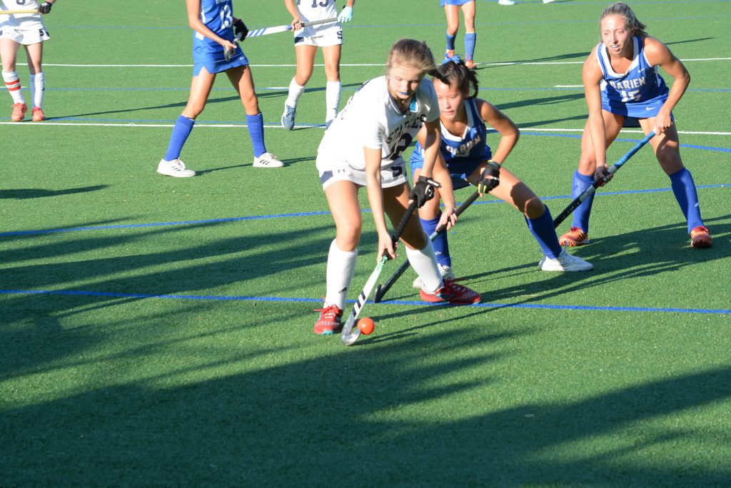 Charlotte Strange competes during a regular season game against Darien this season. Strange scored in an FCIAC tourney game win on Friday–Photo Andy Hutchison