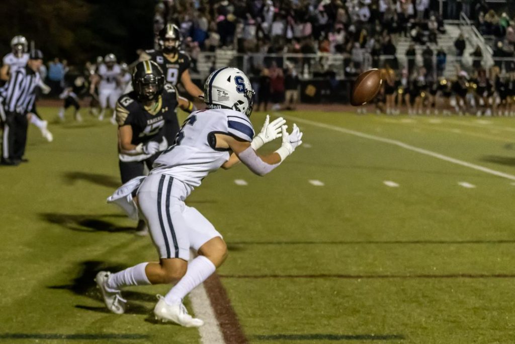 James Hillhouse hauls in a pass for a two-point conversion late in the game–Photo Chris Greer