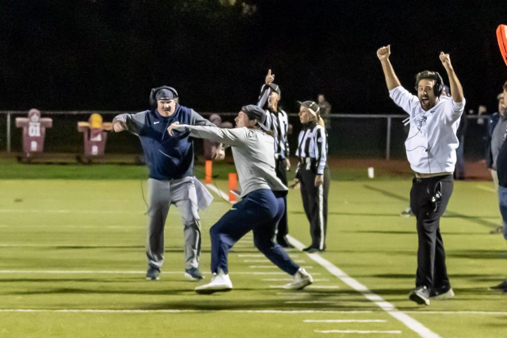 Coach Adam Behrends, Coach Ryan Connors and Coach Phil Abraham celebrate as the Wreckers close out a hard-fought win over Trumbull–Photo Chris Greer