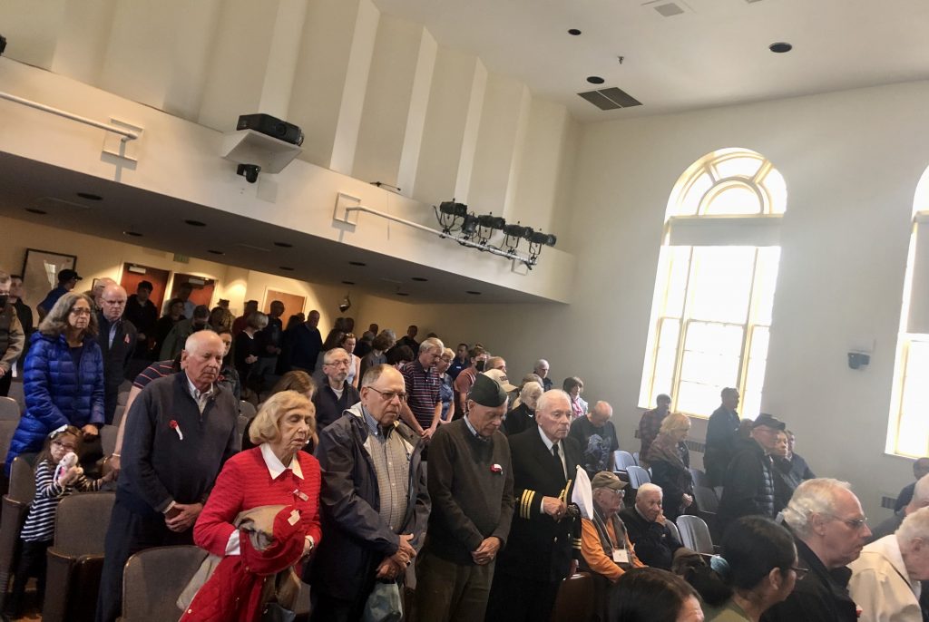 The crowd during the benediction at the Veterans Day ceremony at Town Hall. / Photo by Thane Grauel