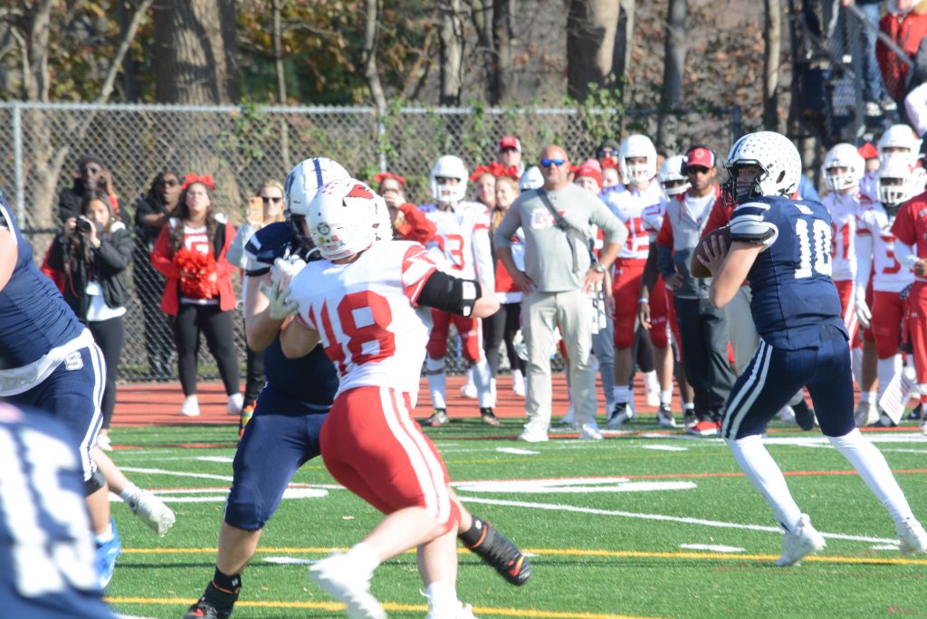 Staples quarterback Caleb Smith throws a pass during the Thanksgiving Day win over Greenwich. Smith and the Wreckers went on to face Fairfield Prep in the state playoffs and came up short in a 23-22 decision on Tuesday night - Photo Andy Hutchison