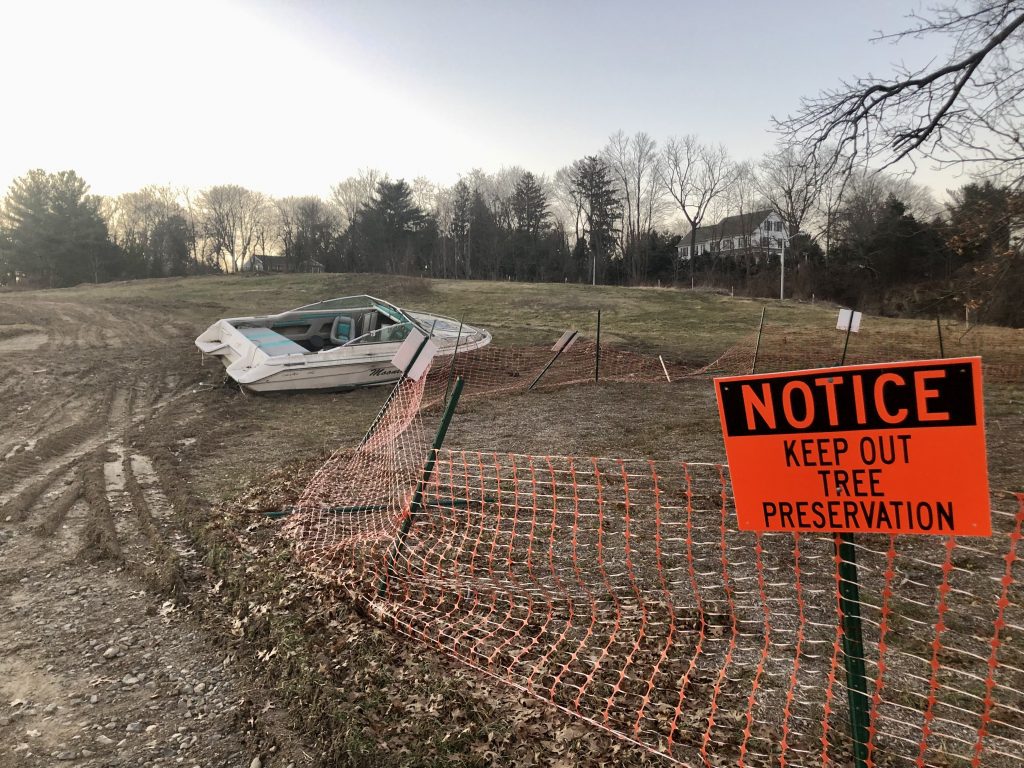 A boat was dumped on the I-95 Exit 17 southbound ramp median over the holiday weekend. / Photos by Thane Grauel