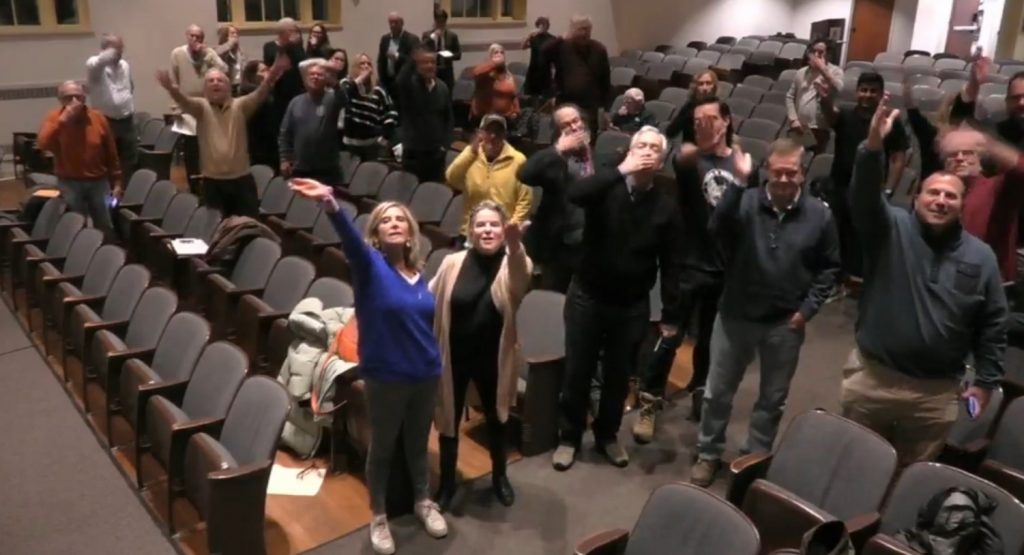 The Representative Town Meeting blew a collective kiss to Cathy Talmadge, District 6, who is seriously ill.