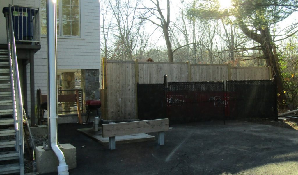 The dumpsters outside Chabad Lubavich are now screened, but still need a variance from the Zoning Board of Appeals. Photo by Planning and Zoning staff.