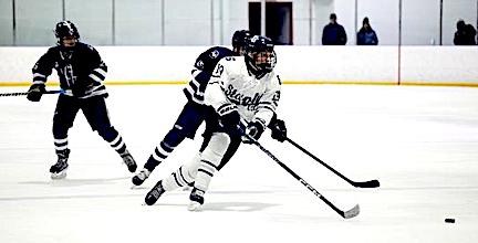 Staples hockey team nets 7-4 victory