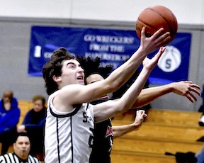 Staples boys basketball caps Senior Night with victory