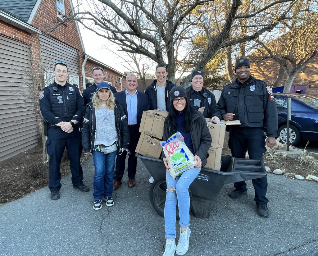 From left, Officer Sean Doyle, Officer Daniel Lovallo, a resident of the Gillespie Center, Chief Foti Koskinas, RTM/Police Athletic League member Andrew Colabella, Anna Rycenga, Officer Scott Thompson and Officer Dominique Carr. / Contributed photo