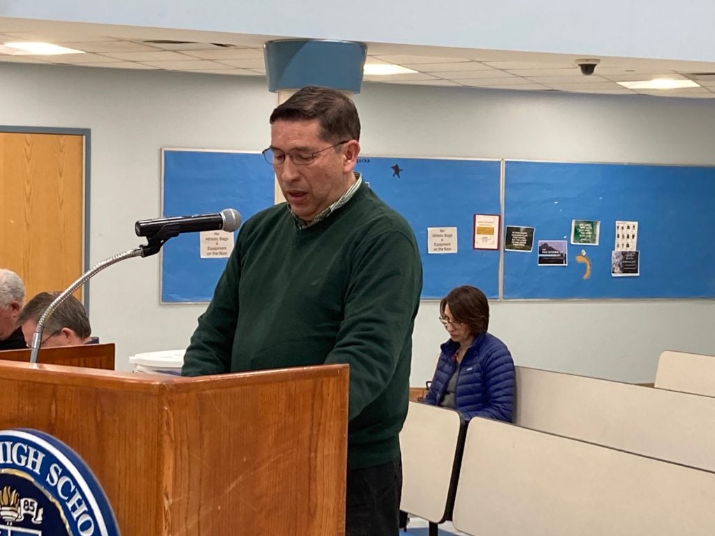 Camilo Riano, a father of four, addresses the school board. / Photo by Linda Connor Lambeck