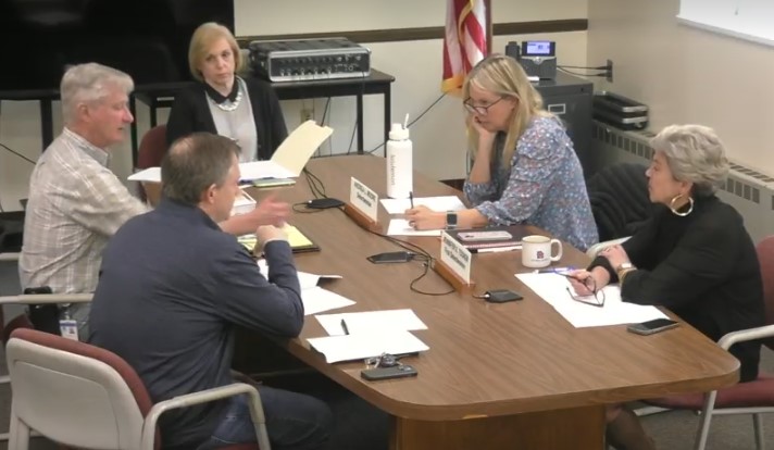The Board of Selectwomen, right, discuss contracts related to Long Lots Elementary.