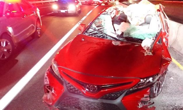 Loose tire on I-95 slams into passing car, shearing off roof