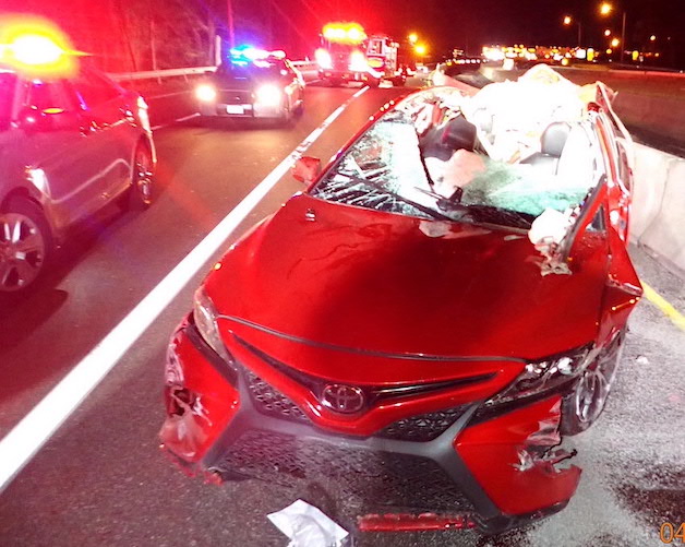 Loose tire on I-95 slams into passing car, shearing off roof