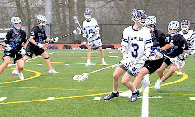Staples boys lacrosse team marches past Cadets