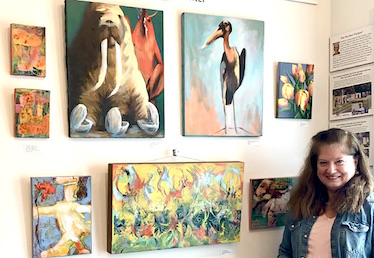 Abstract, figurative paintings displayed at book shop