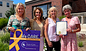 Promoting local observance of “Childhood Cancer Awareness Month” are, from left, Selectwoman Andrea Moore, Liz Vega and Liz Salguero, co-executive directors of Circle of Care, and First Selectwoman Jennifer Tooker.