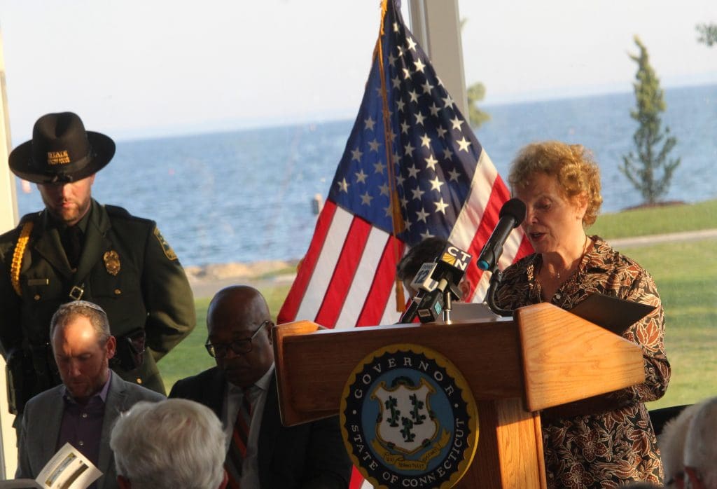 Jean Coleman, whose sons Keith Eugene Coleman and Scott Thomas Coleman, died at the World Trade Center, helps read the names.