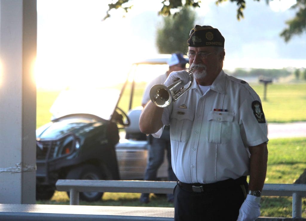 Jonathan Worley of VFW Post 79 in Madison blows taps.