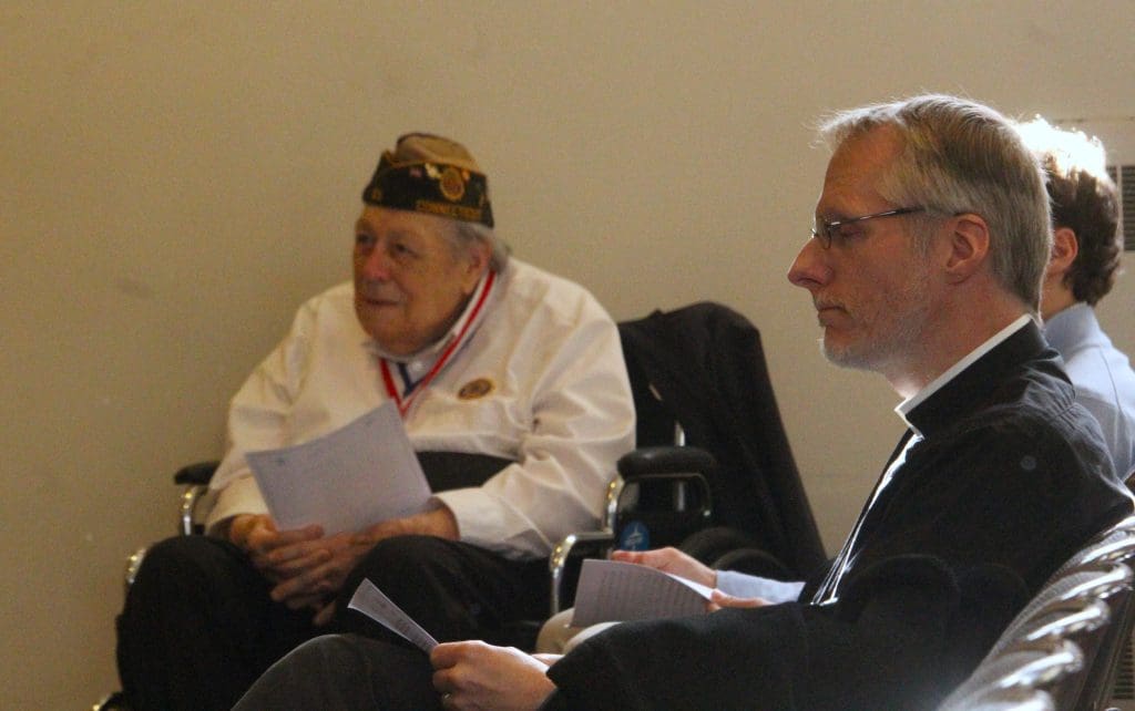 Bill Vornkahl, president of the Westport Veterans Council and the Rev. Kevin Olds.
