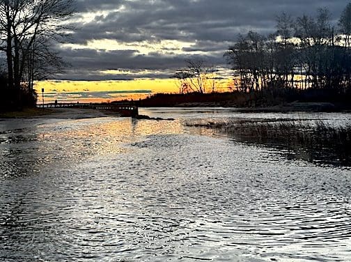 Storm pulls away, but flooding and outages linger