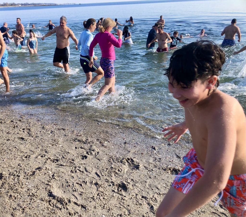 Polar Bear Plungers at Compo Beach. / Photos by Thane Grauel