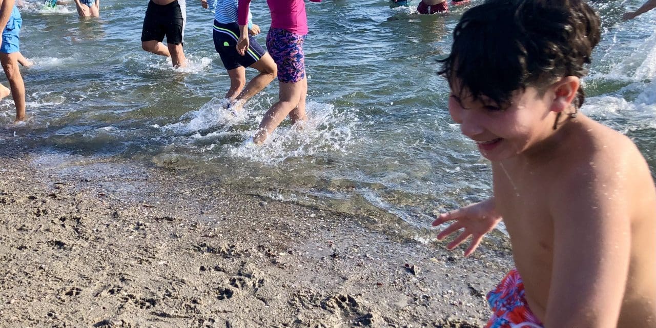 Dozens plunge into chilly Compo waters with brrr-vado