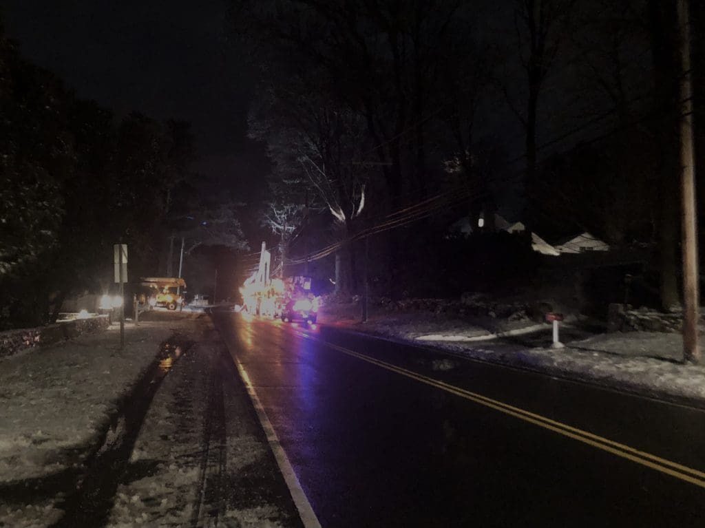 Utility crews were at work into the night on Compo Road South. / Photo by Thane Grauel